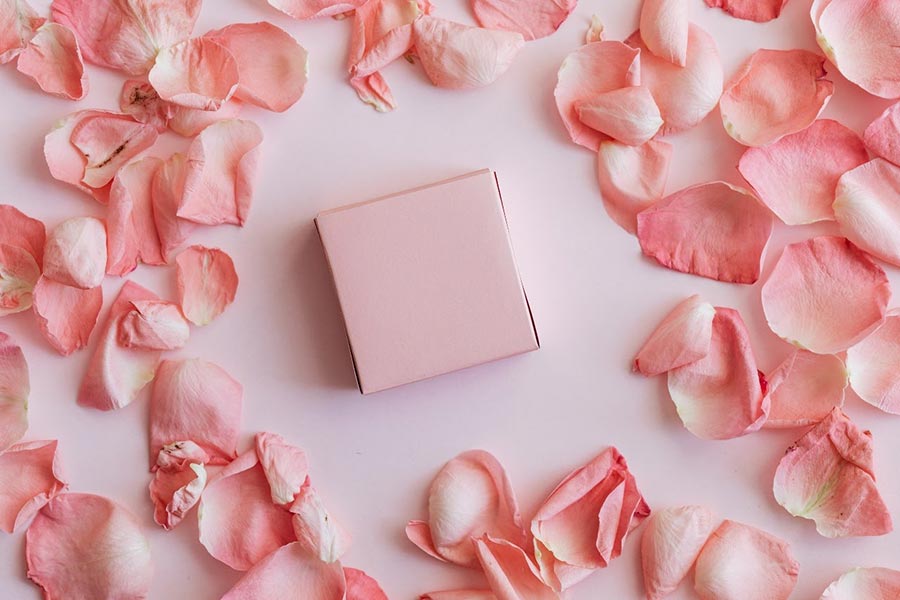 jewelry surrounded by rose petals