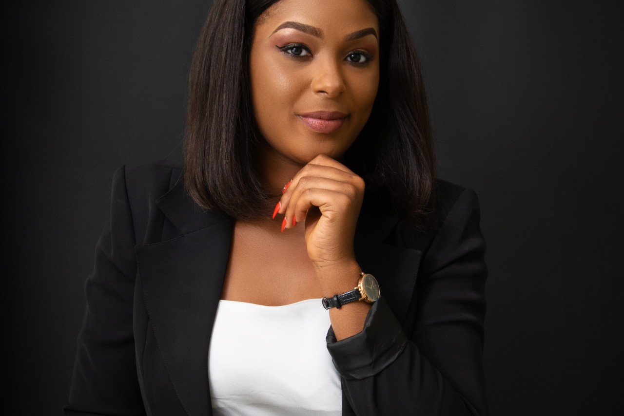 A business woman wears a watch with subtle diamond accents.