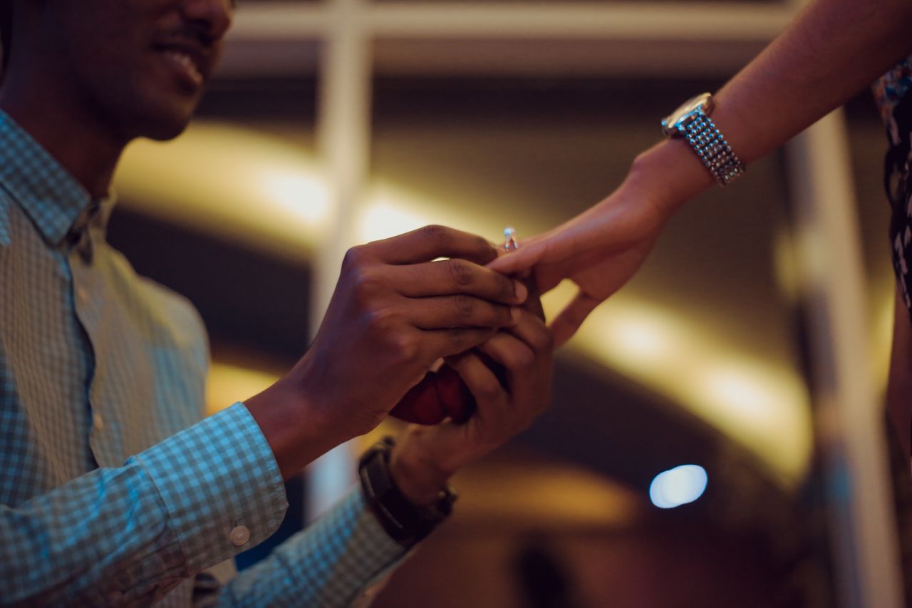 Couple getting engaged with engagement ring