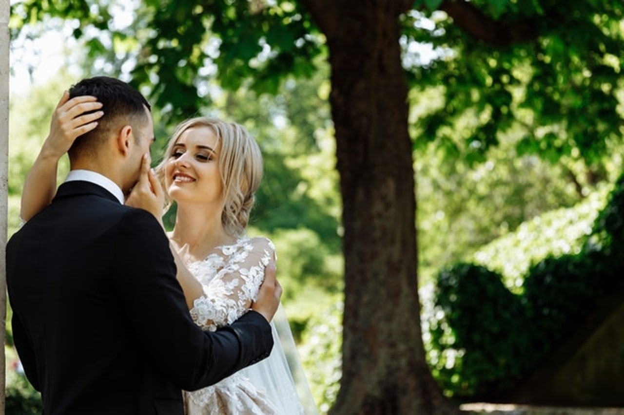 couple embracing in forest