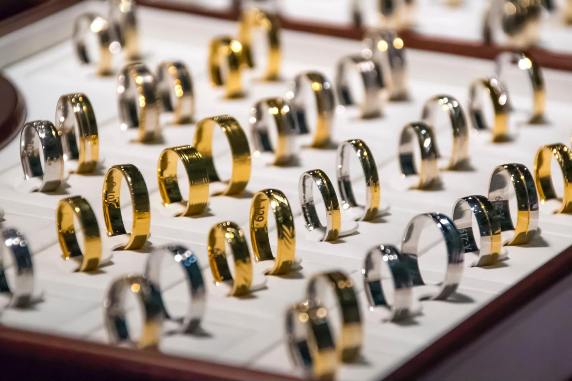 Several men’s wedding bands on display.