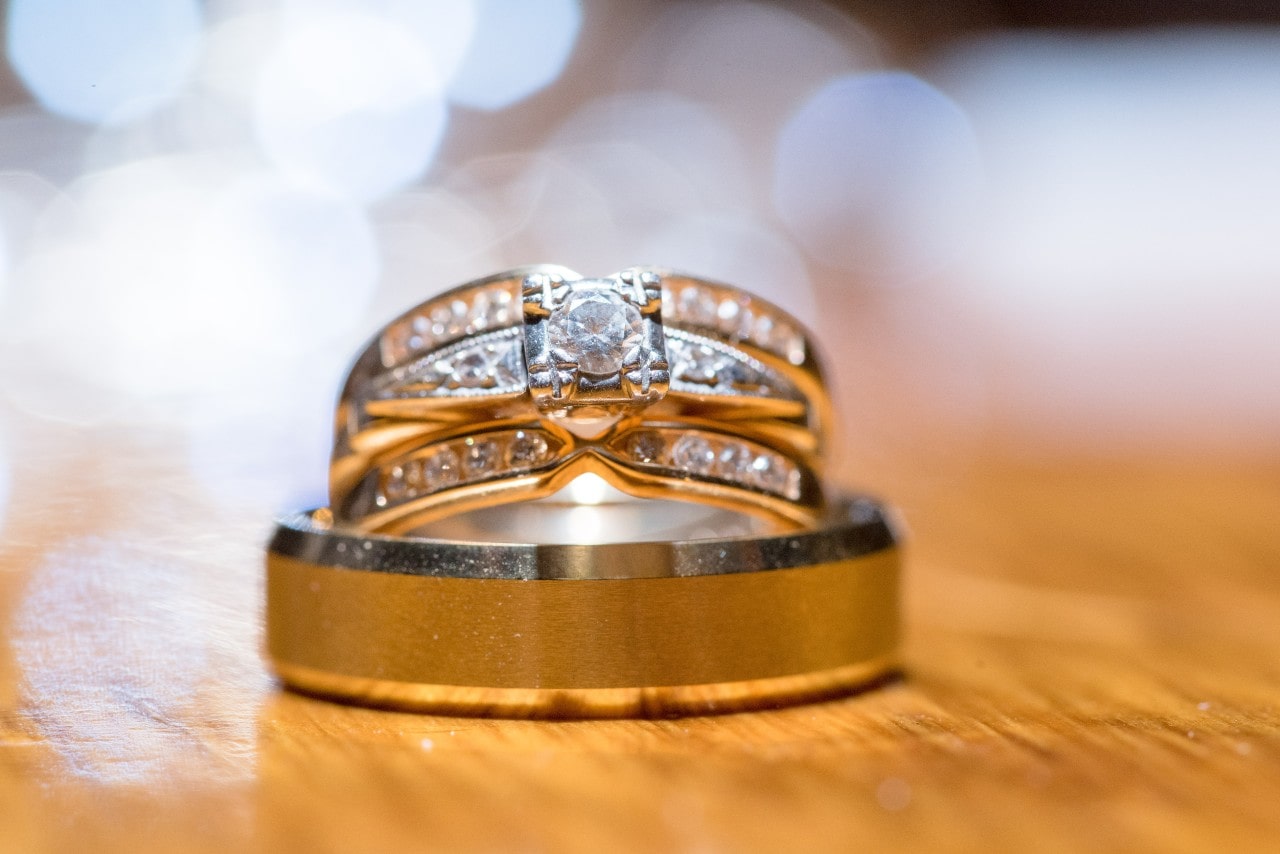 three gold wedding bands stacked up